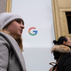 Women walk past Google offices, Monday, Dec. 17, 2018, in New York.